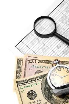 Pile of money sitting next to a chart showing the increase an annuity will earn over the years