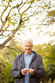 Senior man walking in the park