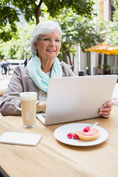 Senior woman using her laptop to get a quote for medicare supplement insurance
