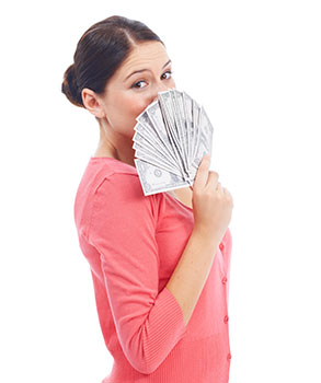 Woman holding a fan of cash