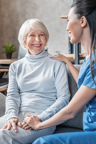 Smiling woman getting help from a long-term care provider